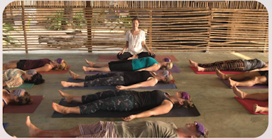 people relaxing in yoga class